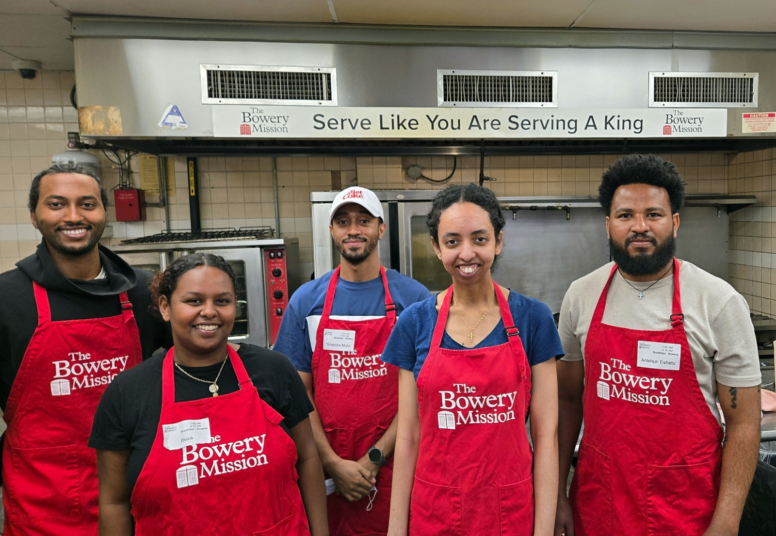 OTY NYC volunteers serve breakfast at the Bowery Mission